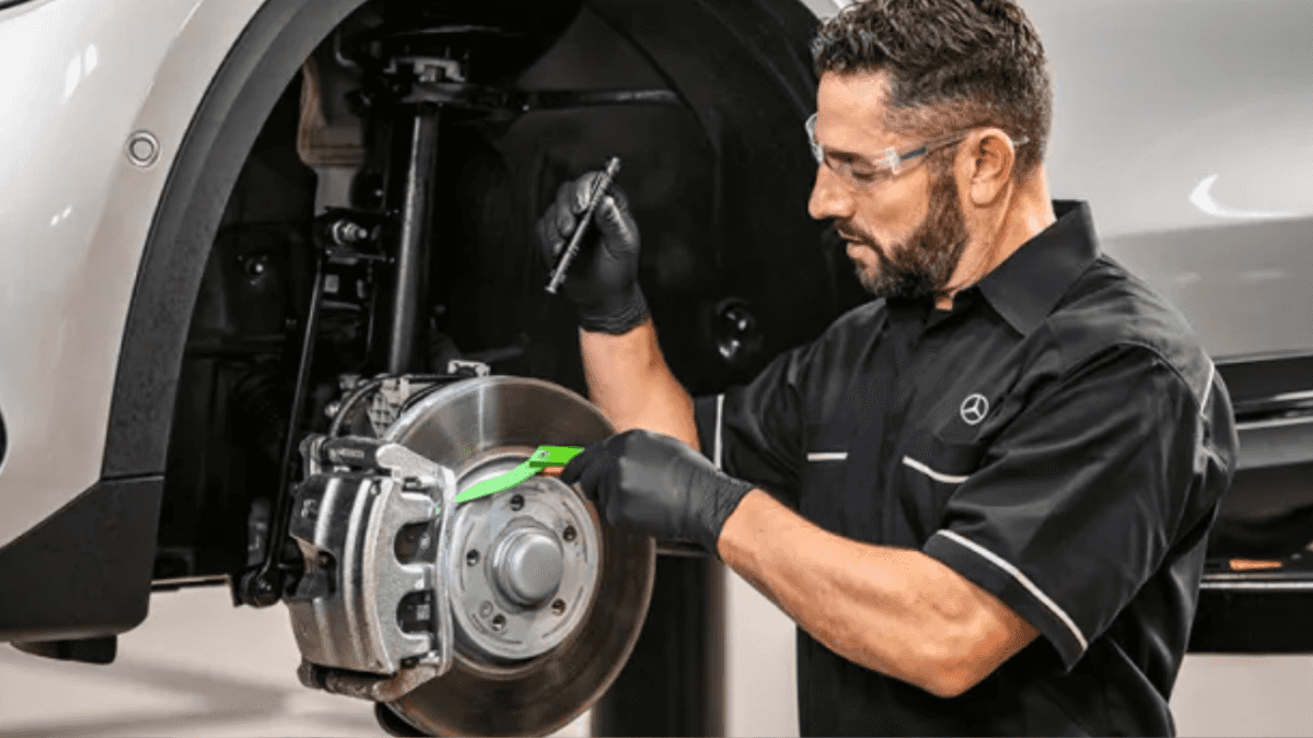 Mercedes-Benz technician inspecting brakes in Coral Gables, FL