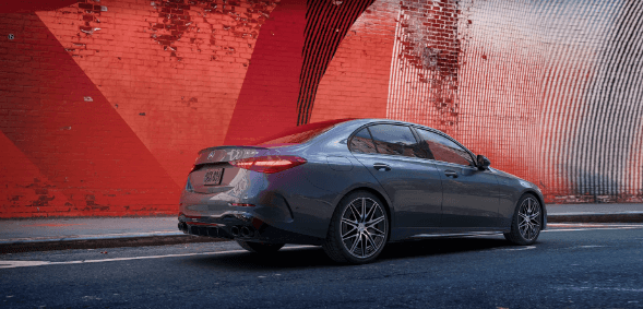 2024 Mercedes-Benz AMG C-Class in front of a red brick wall
