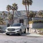 Couple walking up to their 2026 Mercedes-Benz GLC