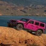 Pink Jeep Wrangler SUV Rocks Water