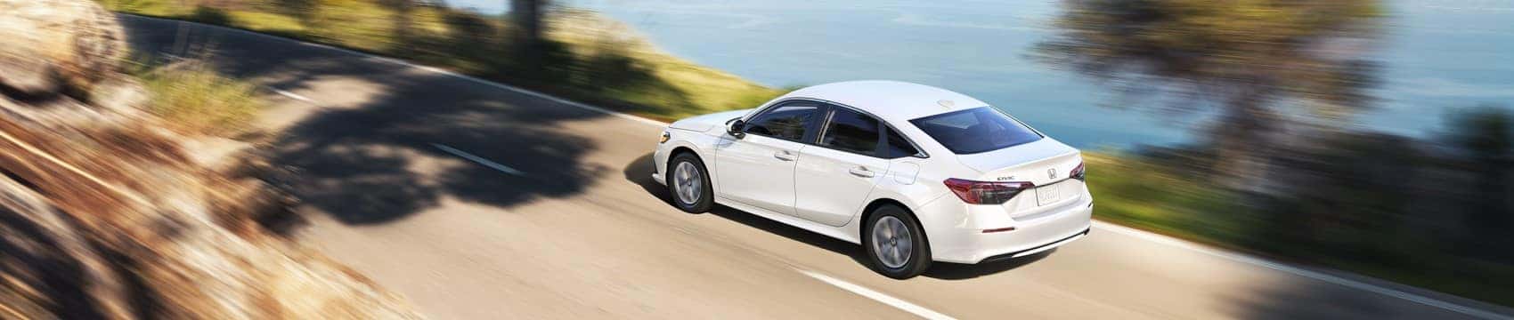 2022 Honda Civic LX white sedan driving on road