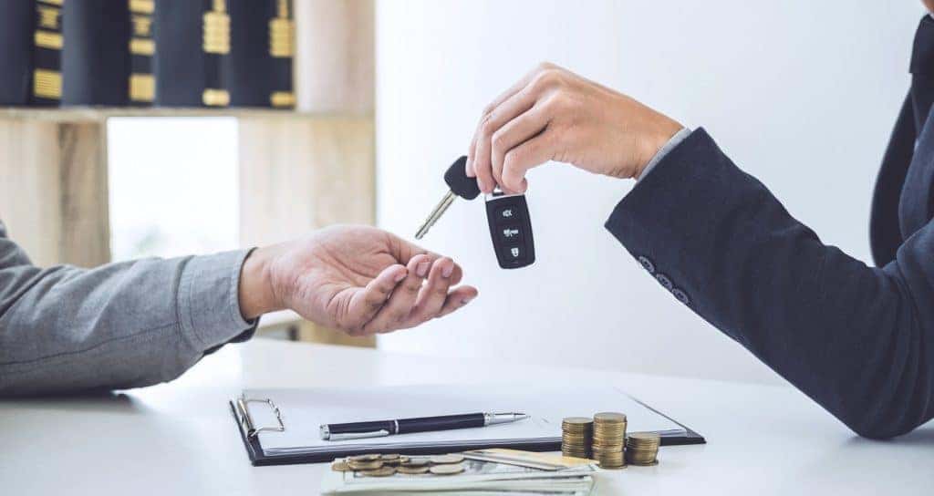 Salesman Handing Keys over to Customer