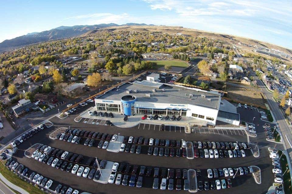 An exterior shot of a Honda dealership during day