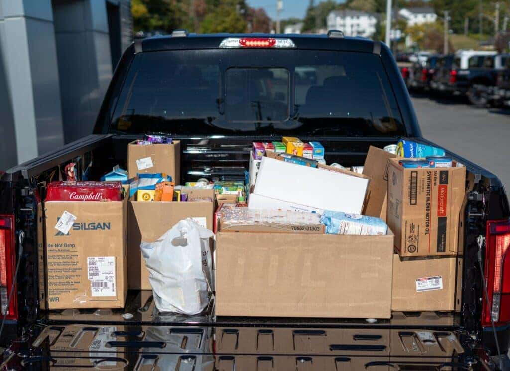 Ford F-150 from Quirk Ford Augusta filled with food for dropoff