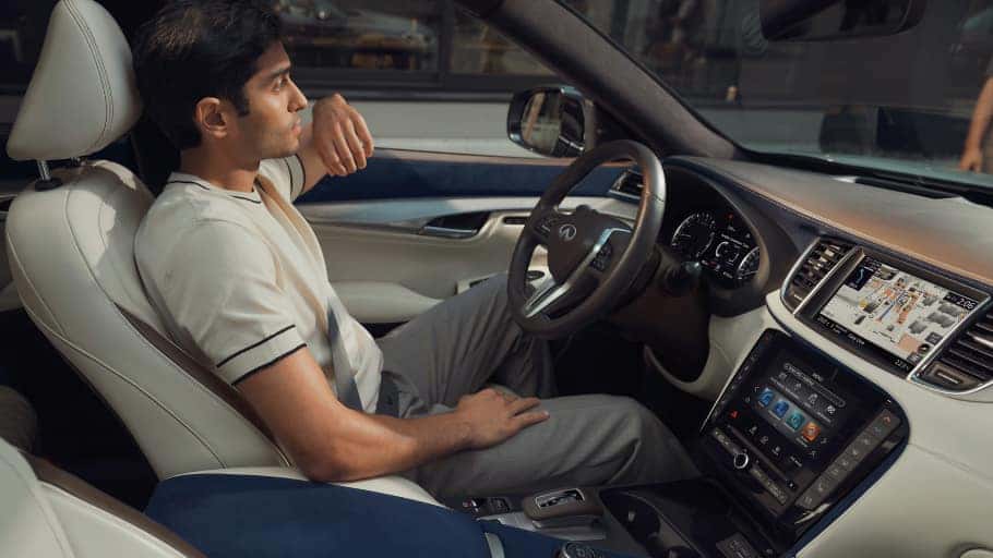 driver sitting in the all new 2024 INFINITI qx50