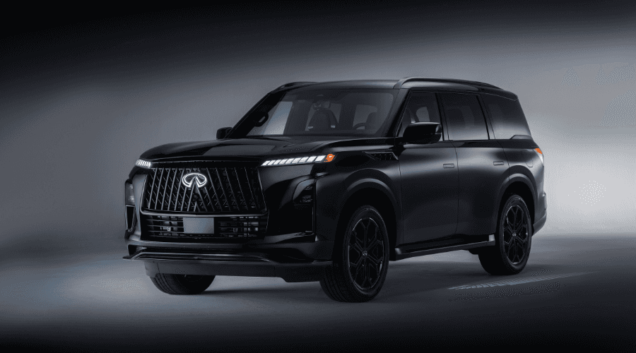 Front three-quarters studio view of the 2026 INFINITI QX80 in Obsidian Black, showcasing its illuminated double-arch front grille emblem, signature piano-key LED headlights, and gloss black wheels at Ramsey INFINITI in Ramsey, NJ
