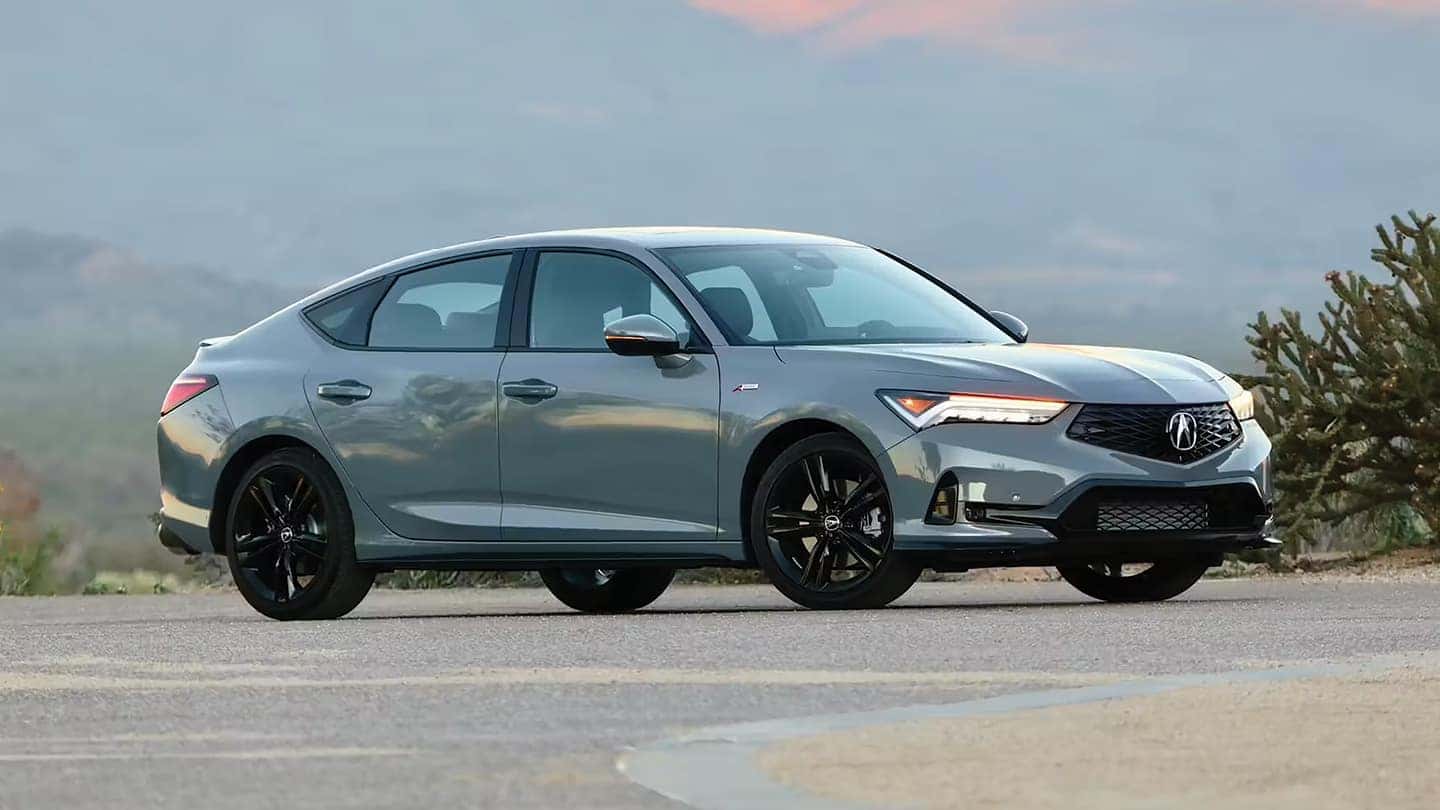Side profile of a used Acura TLX parked near Mahwah highlighting its aerodynamic lines and alloy wheels.