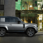 A 2023 Land Rover Defender Driving in a city