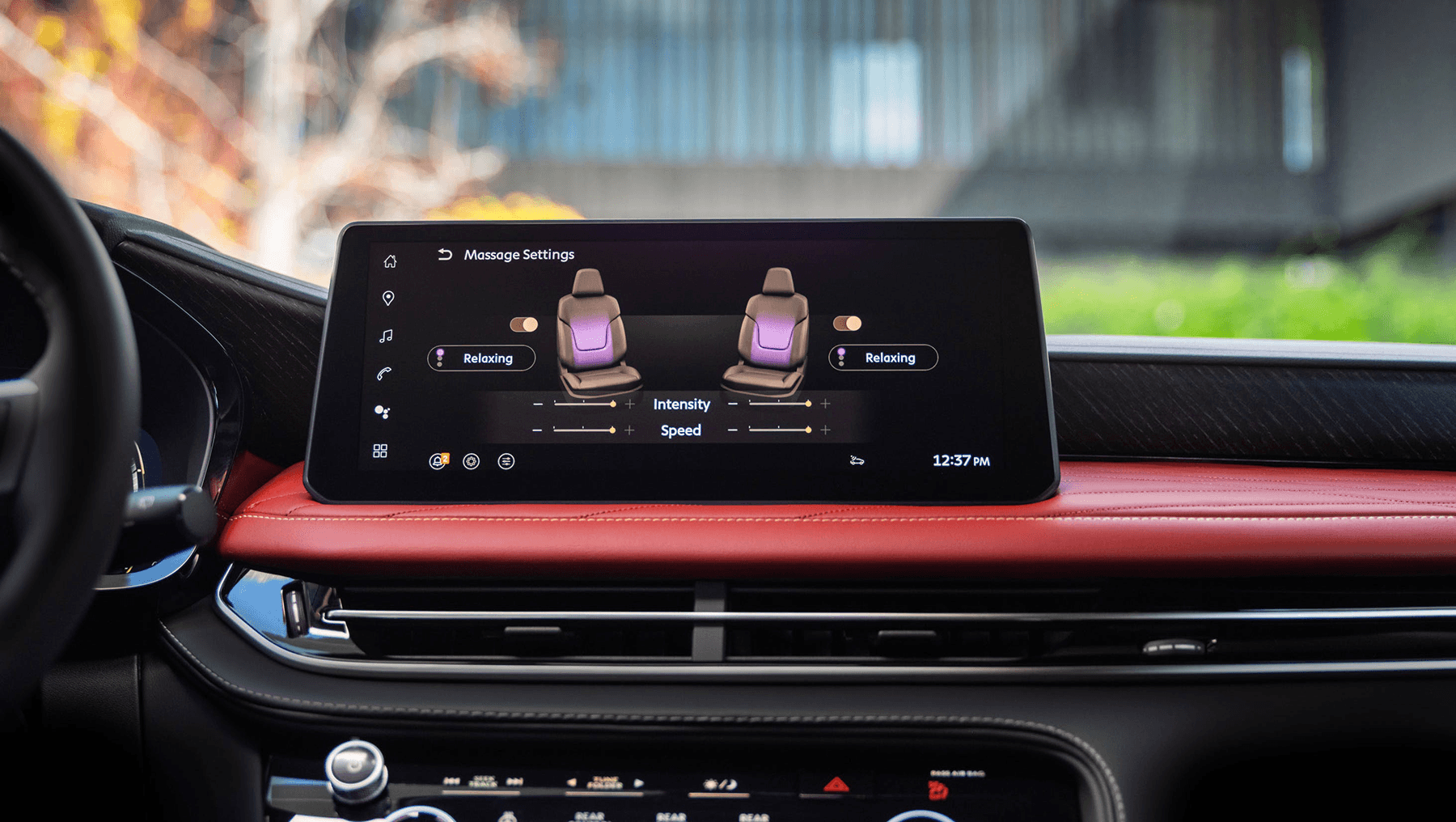 Dashboard display inside the 2027 INFINITI QX65 showing massage seat settings above red leather dash trim and wood accents.