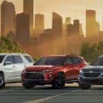 Chevrolet Lineup Against a City Skyline at Sunset