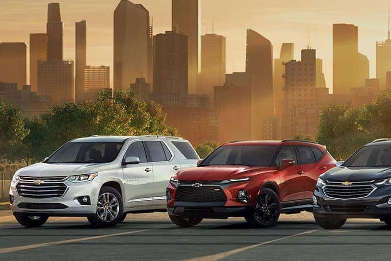 Chevrolet Lineup Against a City Skyline at Sunset_mobile