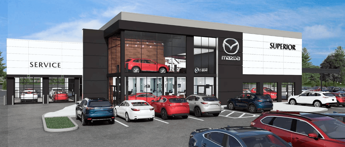 Superior Mazda of Bentonville dealership with cars on lot.