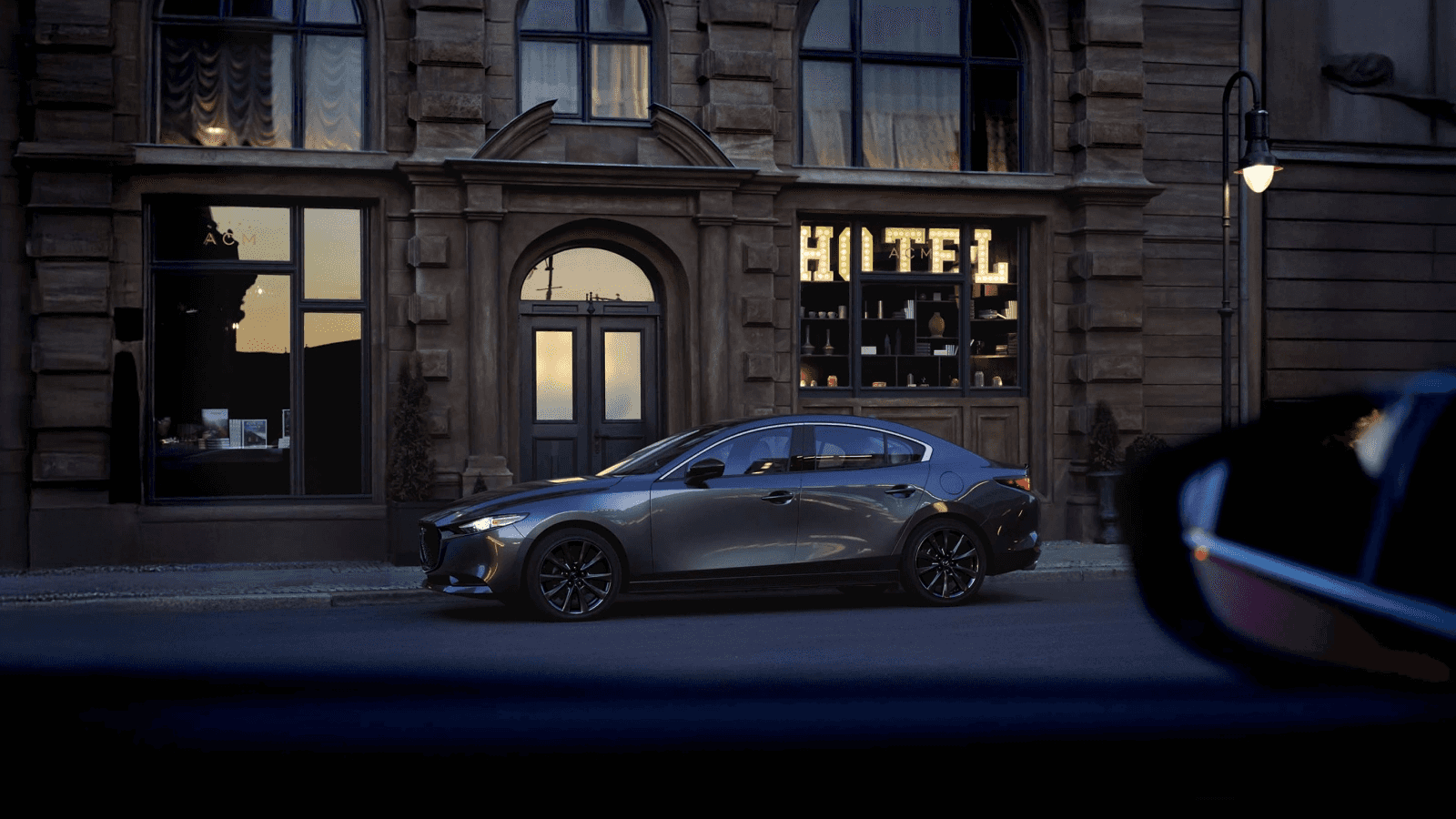New Mazda3 Sedan driving in Bentonville, AR
