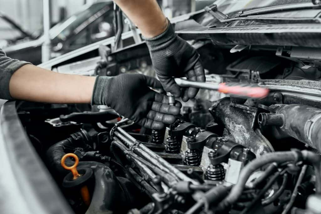 Mechanic working under the hood of a car