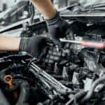 Mechanic working under the hood of a car