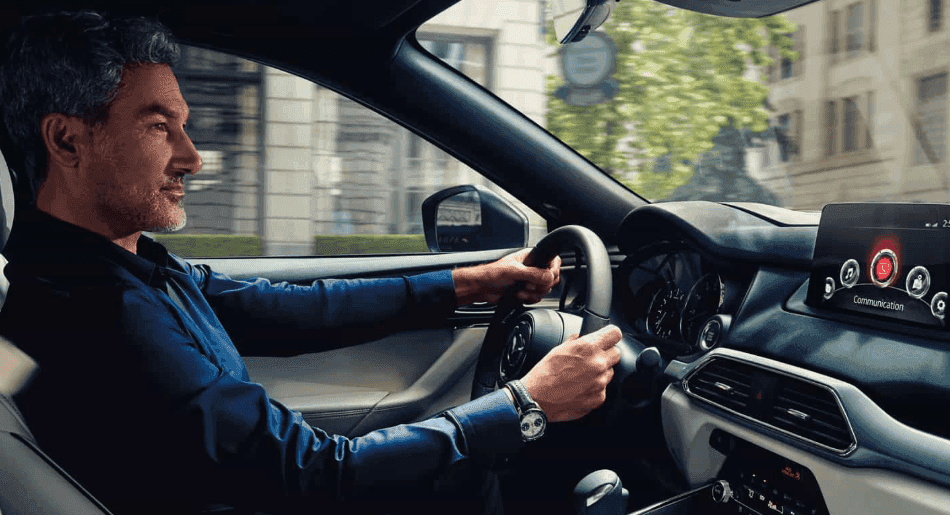 businessman-taking-a-conference-call-while-driving-a-mazda