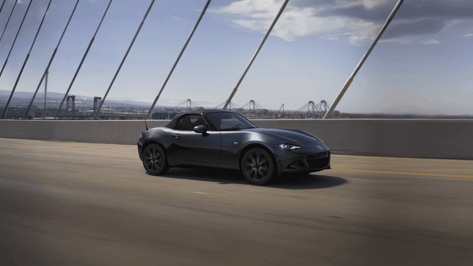 2026-Mazda-MX-5-Miata-driving-on-bridge