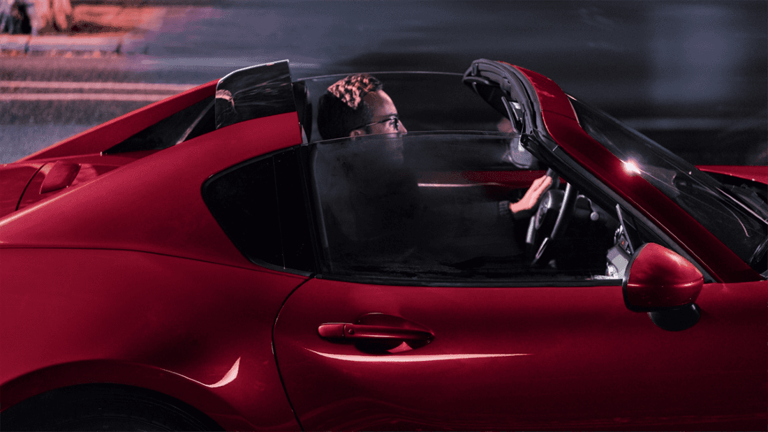 Performance-oriented 2026 Mazda MX-5 Miata RF Club trim with dark alloy wheels and sport upgrades