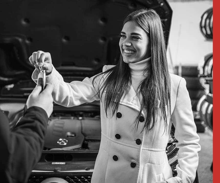 Woman Giving Away Car Key