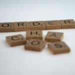a scrabble board showing the word "order".