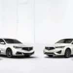 White Acura sedans and SUVs lined up