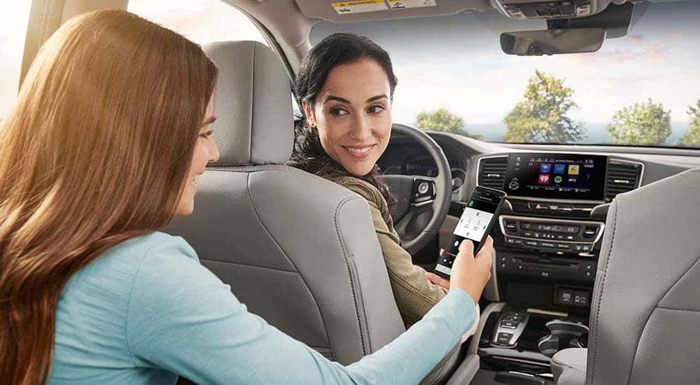Mom and Daughter using Honda Pilot Technology