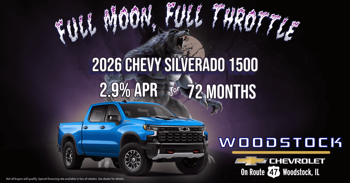 A 2026 Chevrolet Silverado 1500 parked under a full moon with a werewolf silhouette in the background, promoting Woodstock Chevy’s 2.9% APR for 72 months Full Moon Financing offer in Woodstock, Illinois.