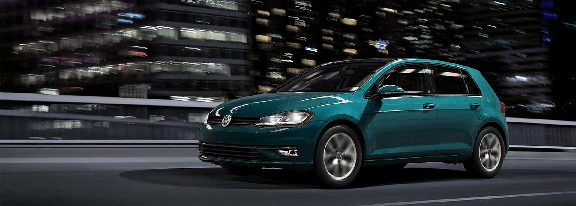 2019 VW Golf driving through a city.