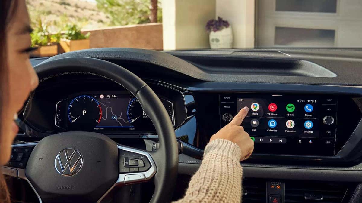 Woman using touchscreen in Taos